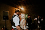 Bride and groom kissing after first dance
