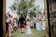 Bride and groom walking out of wedding ceremony