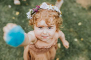 Flower girl holding up flowers