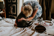 Lady hugging her dog