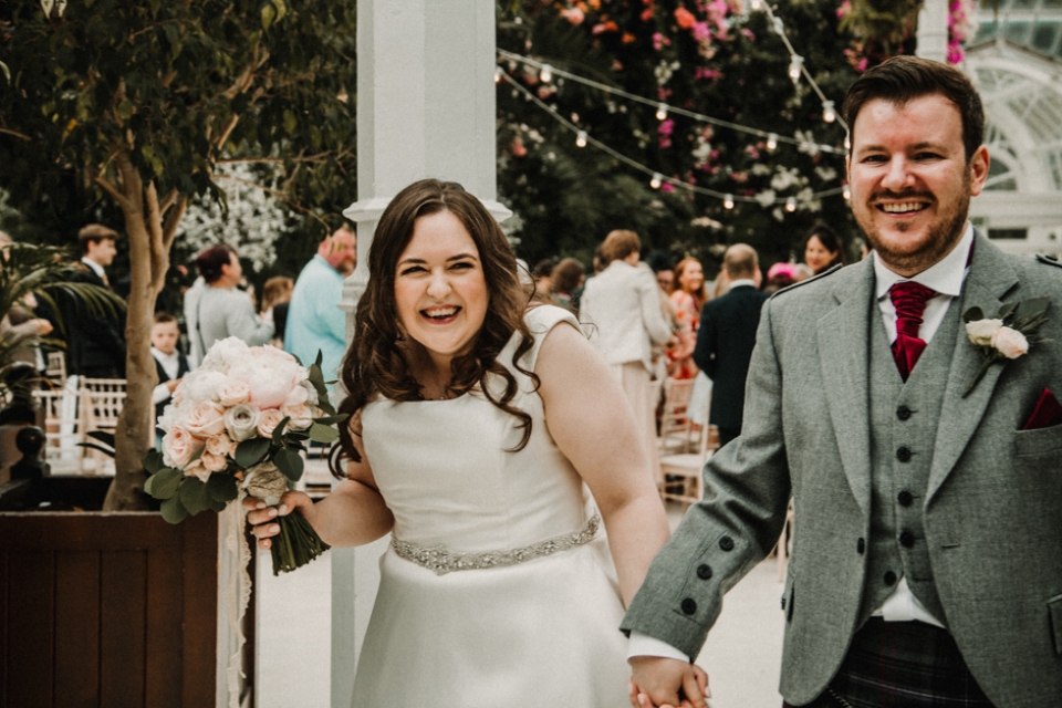 bride and groom walking down aisle together married