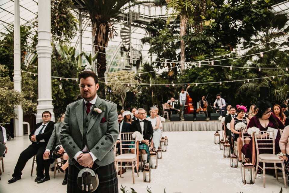 groom nervously awaiting bride