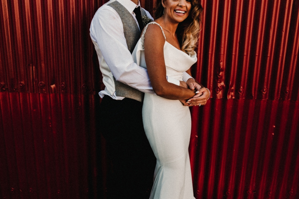 bride and groom enjoying a cuddle at the barn , norther ireland