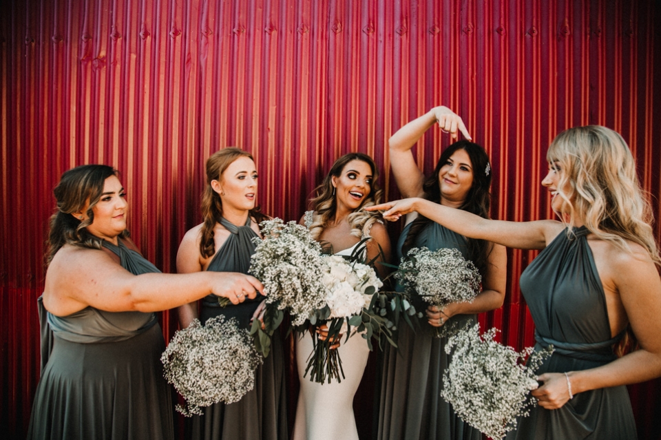 bridesmaids being cheeky and laughing 