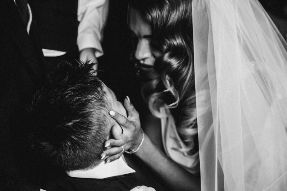 bride adoring her son during the ceremony