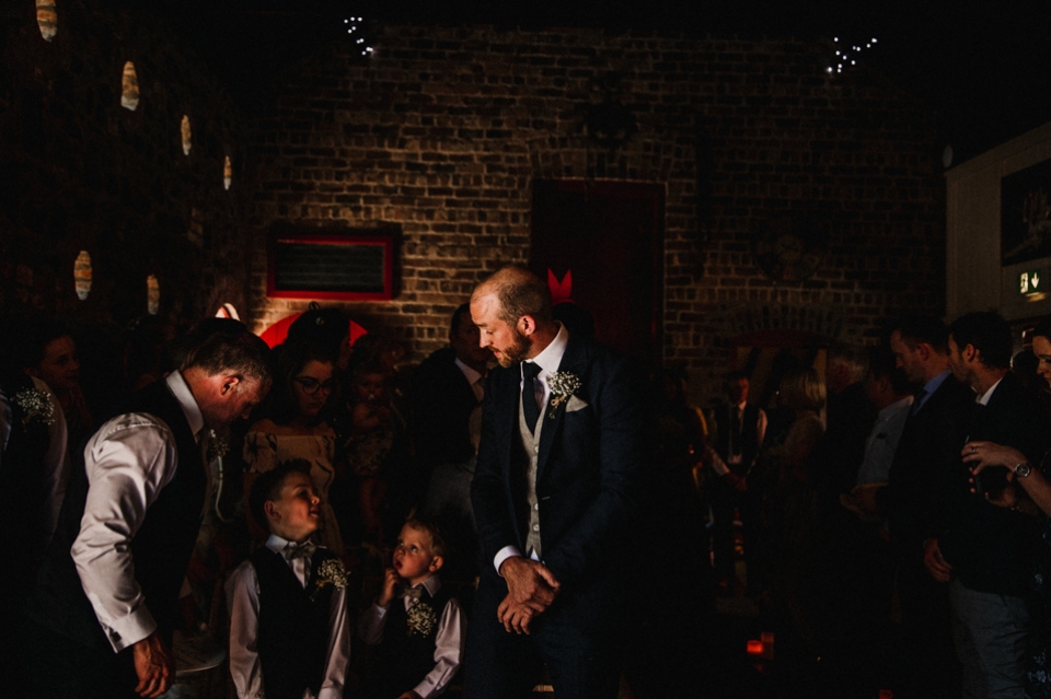 groom and groom sons , best man waiting for the bride to enter the ceremony room