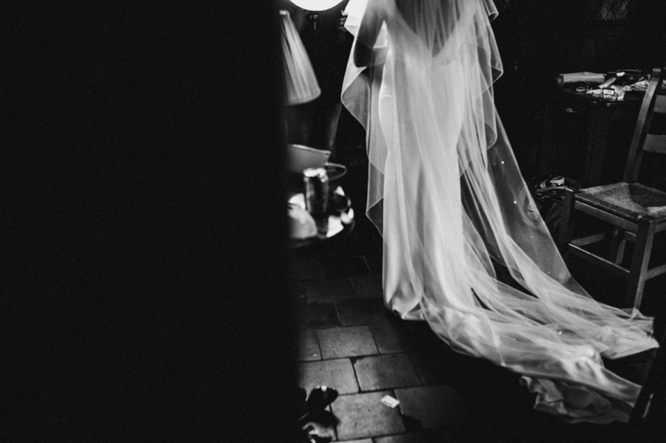 brides rain and veil cascading in the light