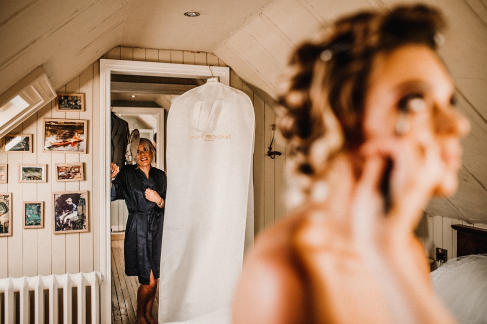 brides mother admiring her daughter during bridal prep