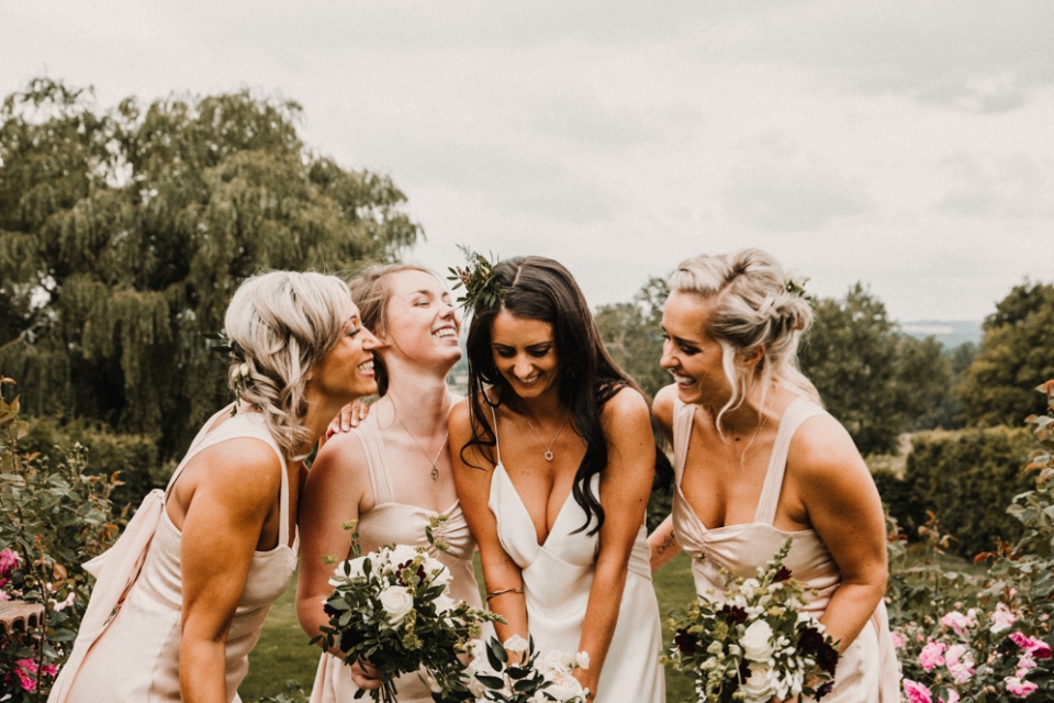 bridesmaids having a giggle at Merris court wedding venue , relaxed portraits