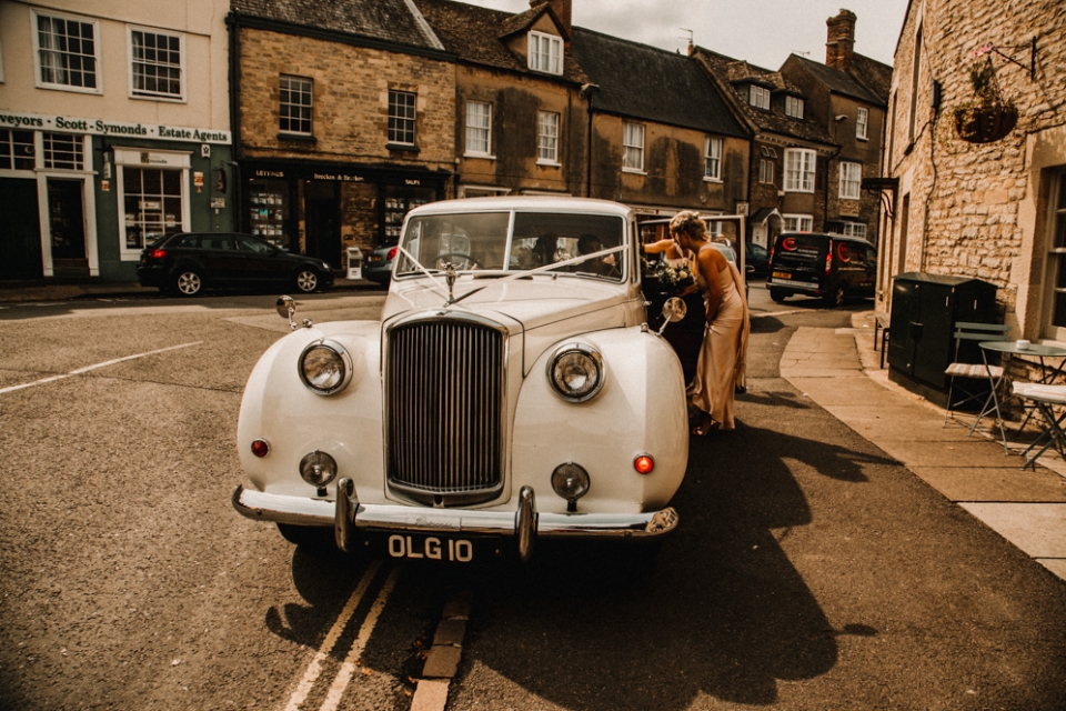 wedding car collecting bridal party from Woodstock , the crown 