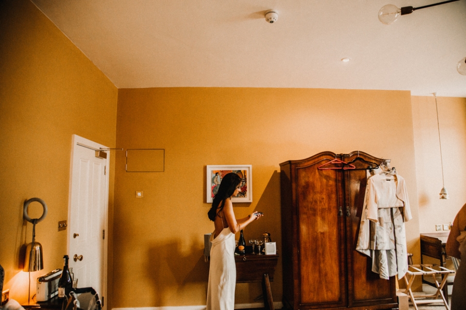 BRIDE DURING BRIDAL PREP AT MERRIS COURT