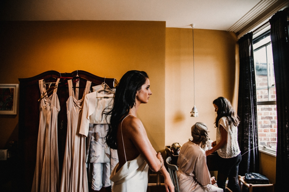 bride wearing a wedding gown by the row at merris court wedding venue