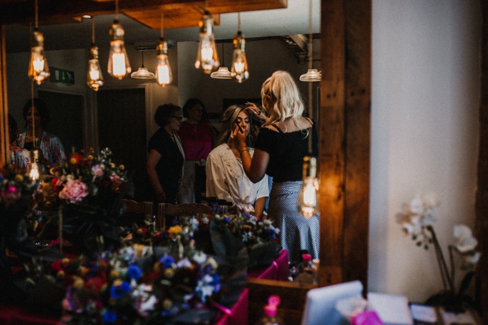 bride having her makeup down at derby wedding venue