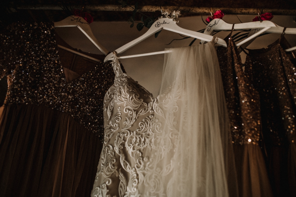 bridesmaids dress and brides wedding dress hanging at west mill 