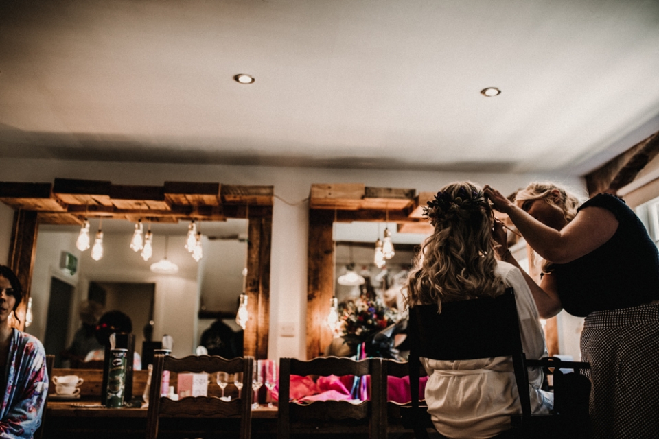 bride having her makeup done during bridal prep