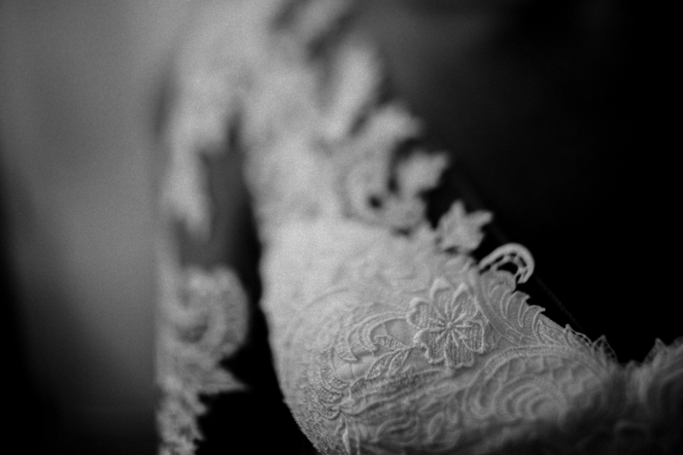 bridal wedding gown close up , black and white wedding photography.