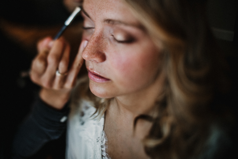 bride having her makeup done , glamours bohemian bride