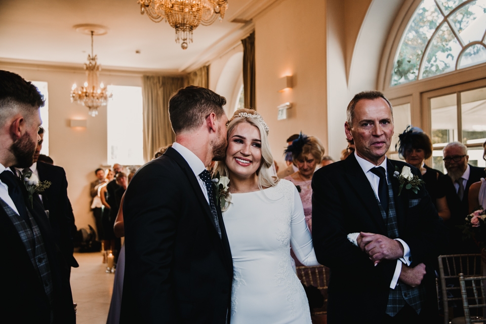 father of bride walking bride down aisle