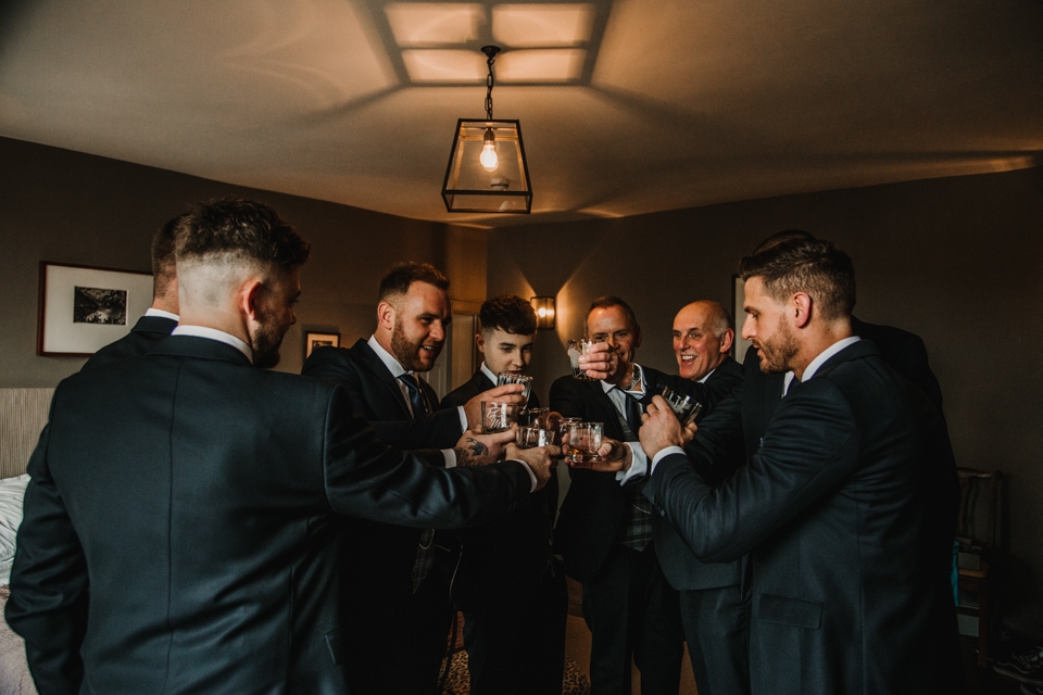 groom enjoying a drink 