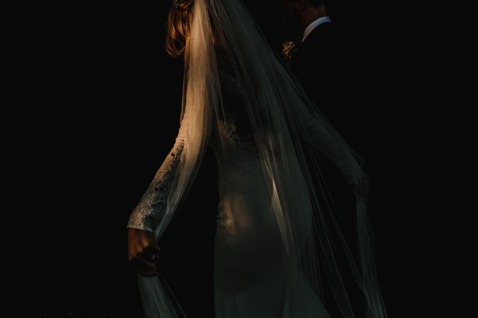 beautiful light highlighting brides veil and pronovias dress