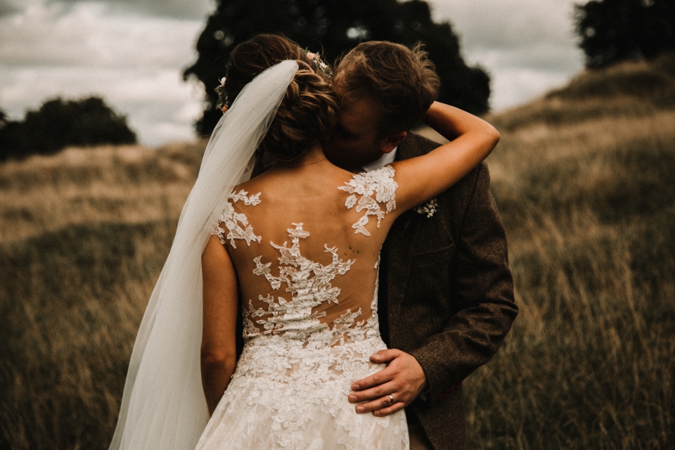 beautiful bohemian wedding gown and intimate portraits , kingscote barns