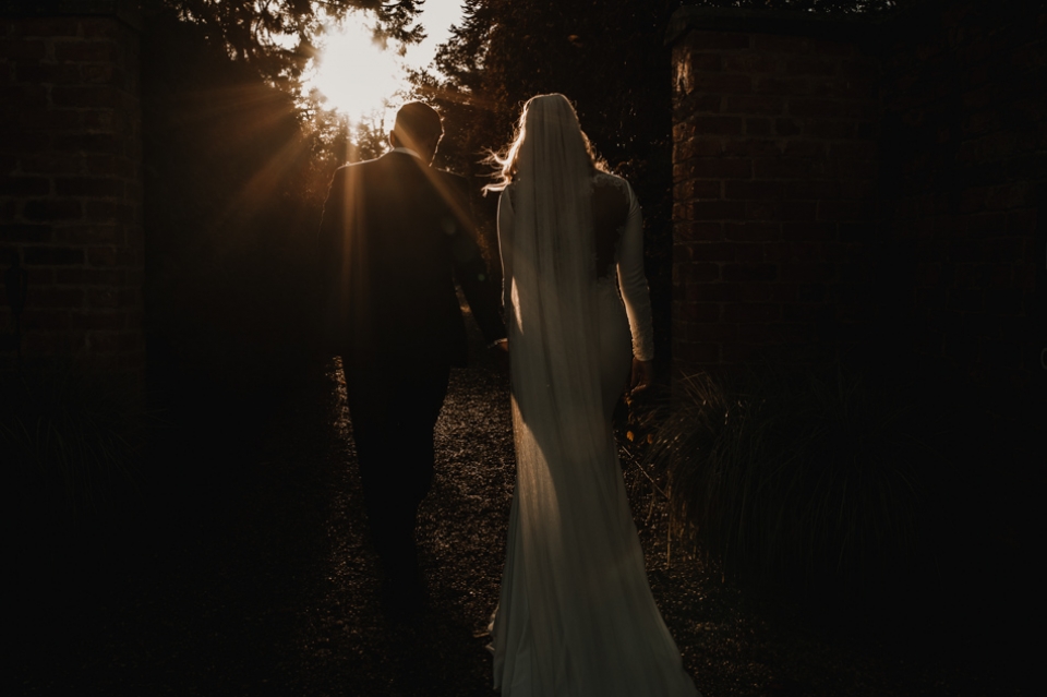 sun light and bride and grooms in Iscoyd park