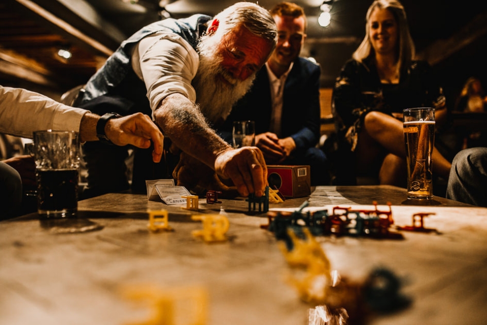 father of groom playing evening games with bridal party