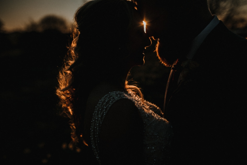 SILHOUETTE PORTRAIT OF COUPLE DURING GOLDNE HOUR