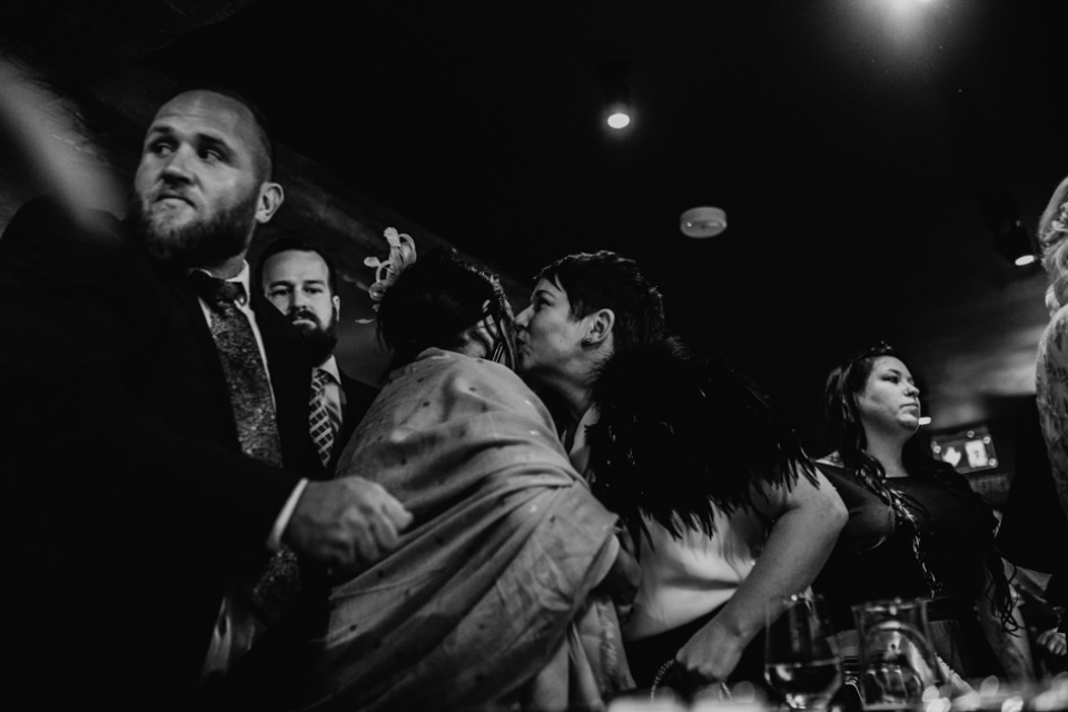 groom s sister kissing her friend at party 