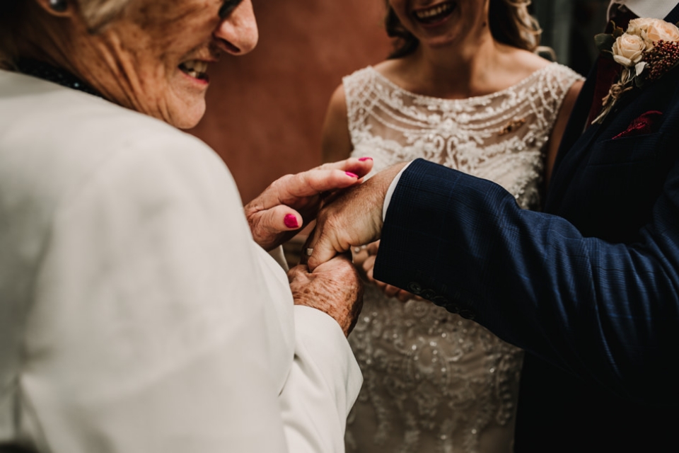 nan looking at bride and grooms wedding rings