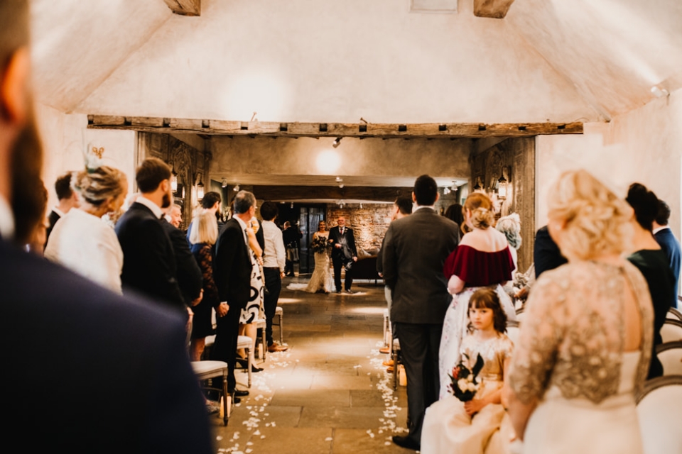 bride walking down the aisle at scottish northumberland wedding ceremony