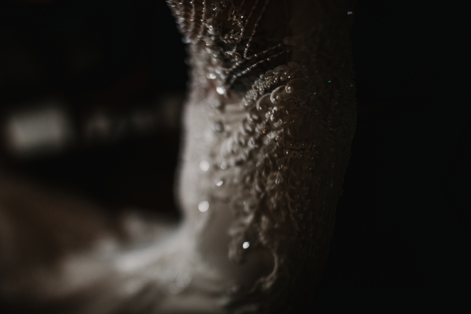 beautiful romantic close up of brides beadwork on wedding dress