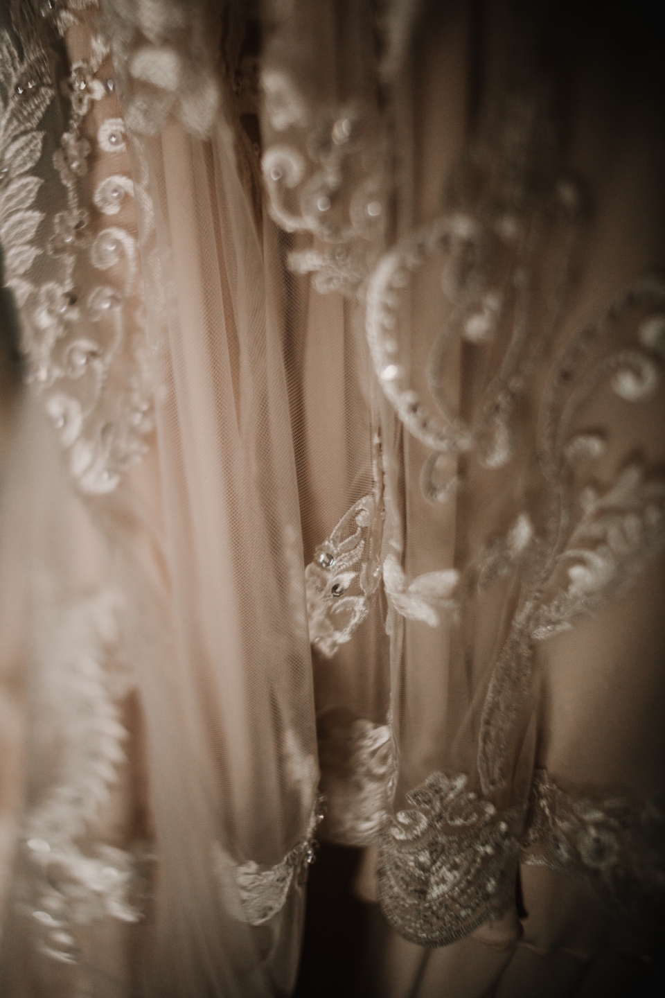 close up detail of the textures in brides wedding dress