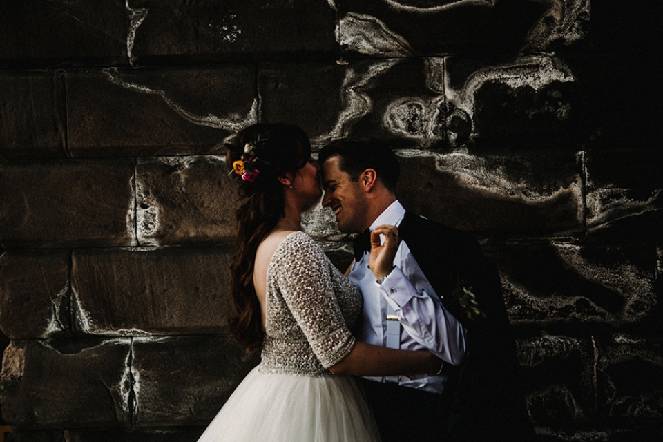 bride and groom under the chester bridge