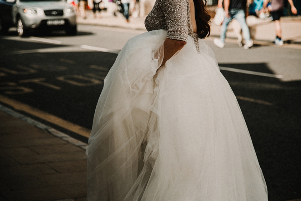 bride having a sex in the city moment in the streets of chester