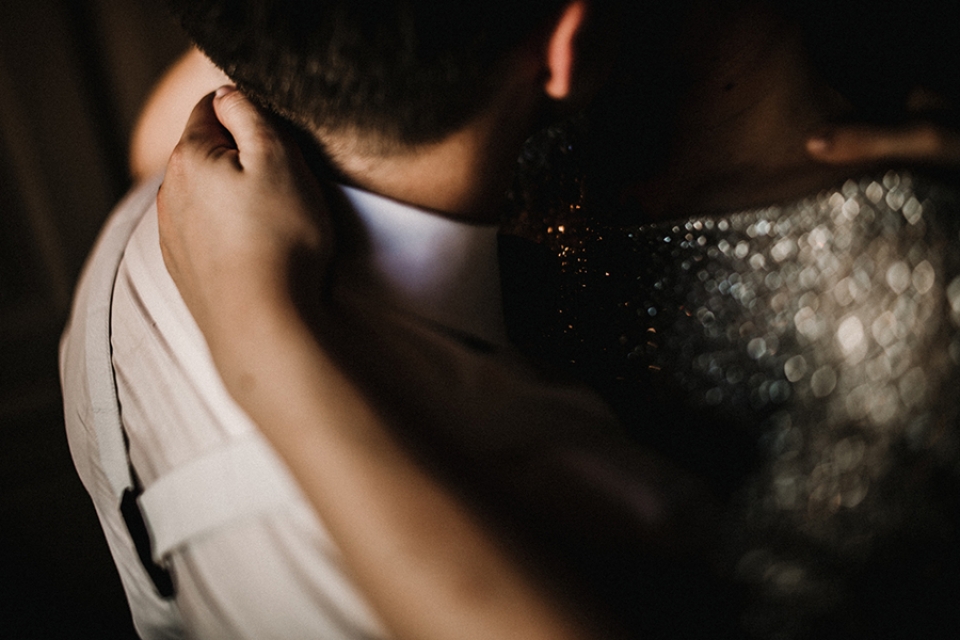 bride and groom enjoying a cuddle in the amazing light at Oddfellows window