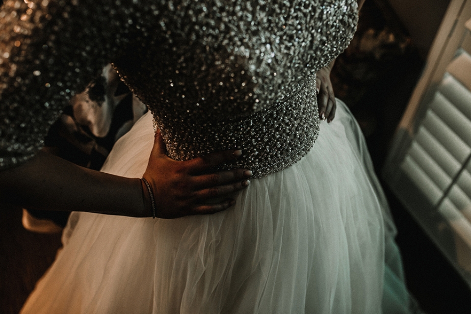 bridesmaid donning maggie sotterro dress