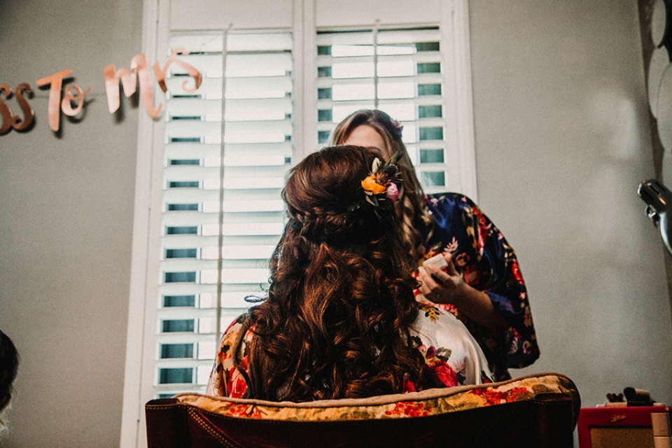 bridesmaid having her makeup done