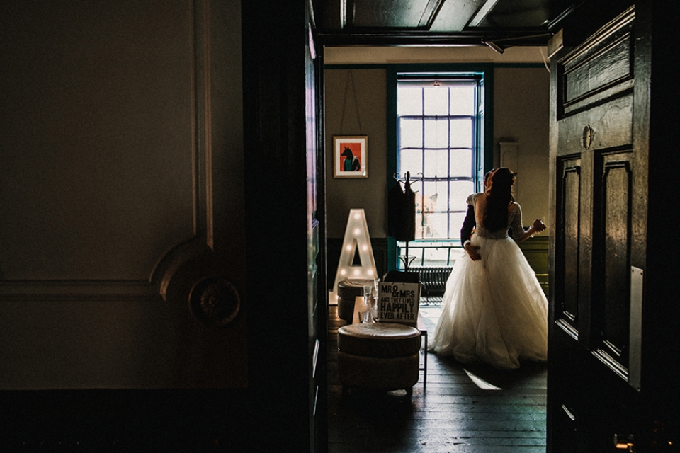 bride and groom practicing their first dance