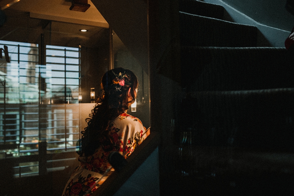 bride checking her makeup and hair in the mirror