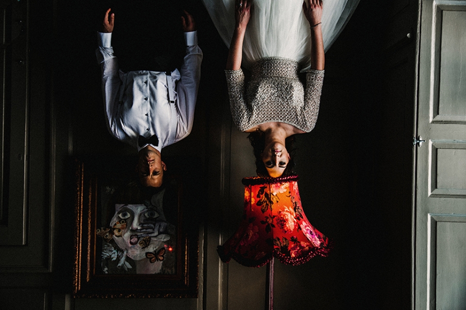 bride and groom , quirky image of them hanging upside down in oddfellows venue