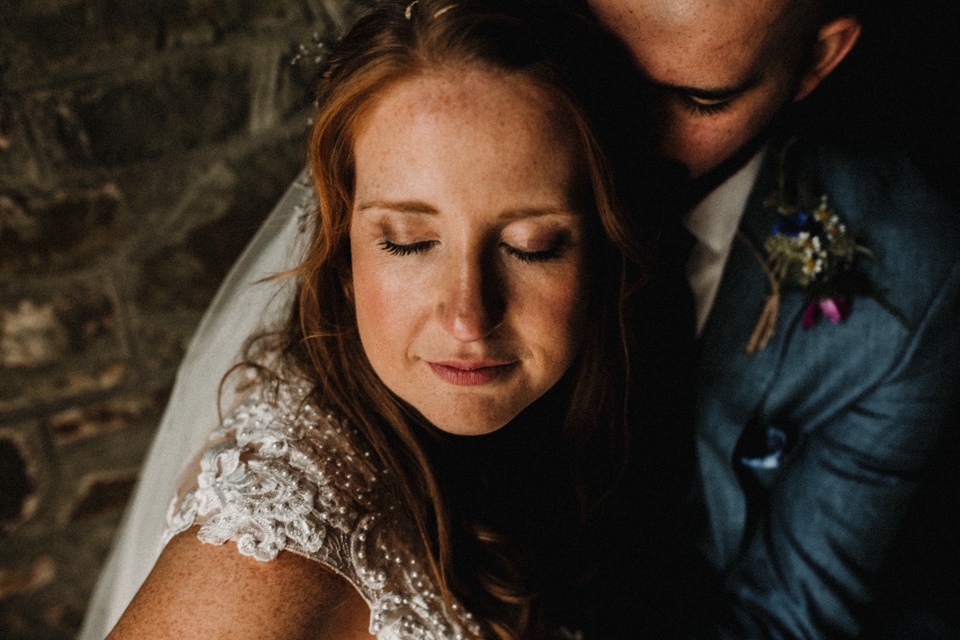 bride and groom by the boat house , buckland house wedding