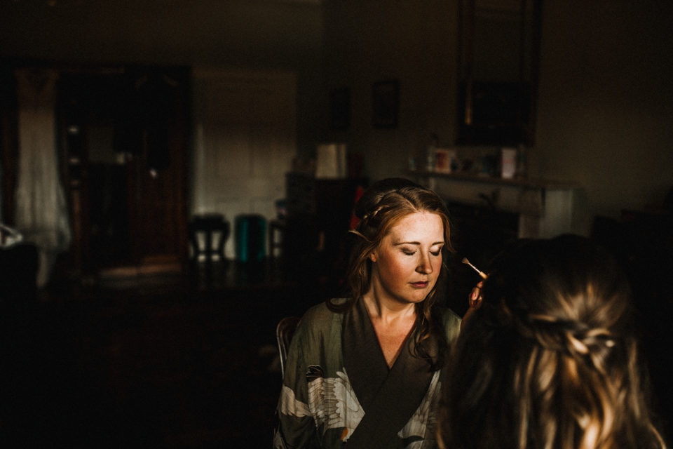 bride having her makeup done at devon wedding photographer