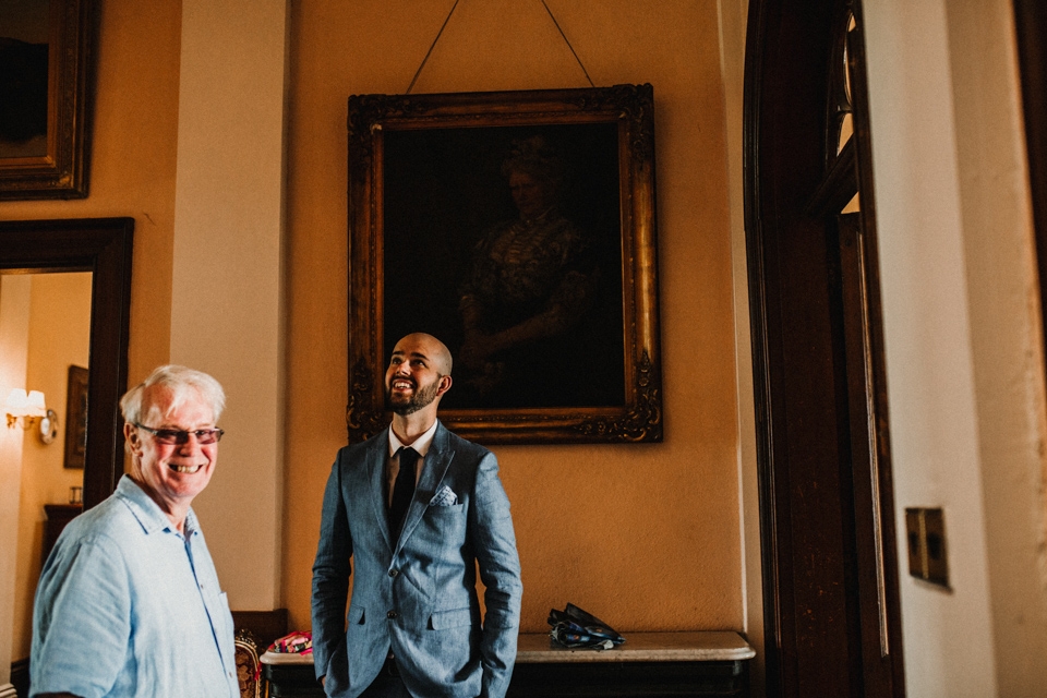 groom laughing with father of the bride