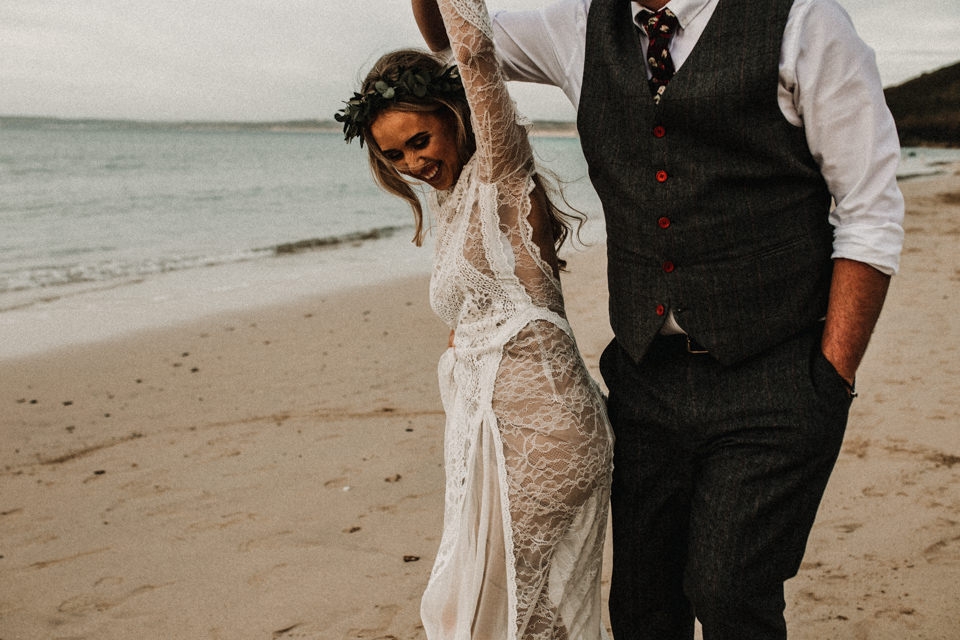 bride and groom playful beach portraits 