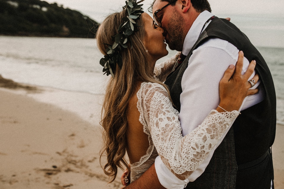 bride and groom kissing on the beach in Carbis Bay