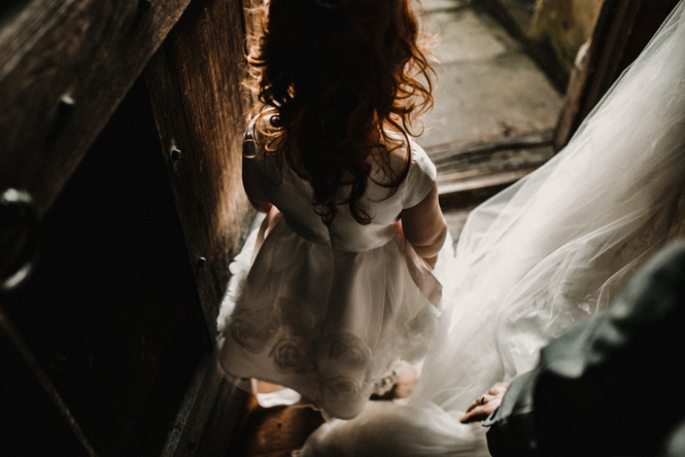 Brides daughter , Opheilia looking out the door onto the italian gardens