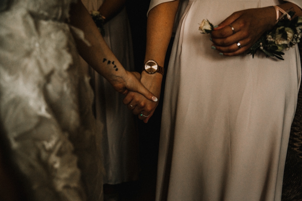 bride and bridesmaid having a moment before the wedding ceremony