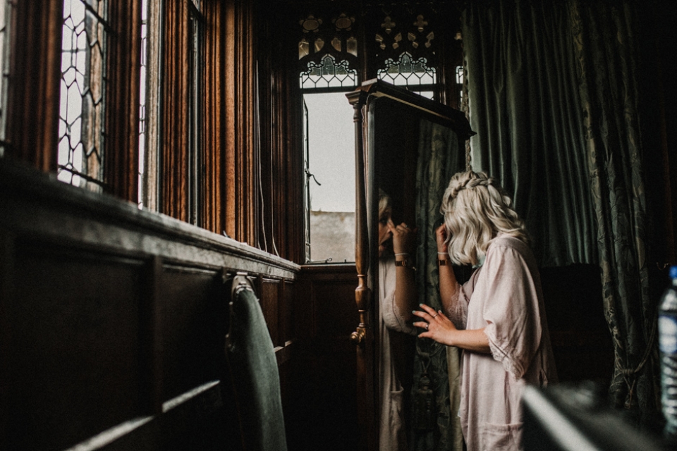 bridesmaid putting her makeup on during bridal prep