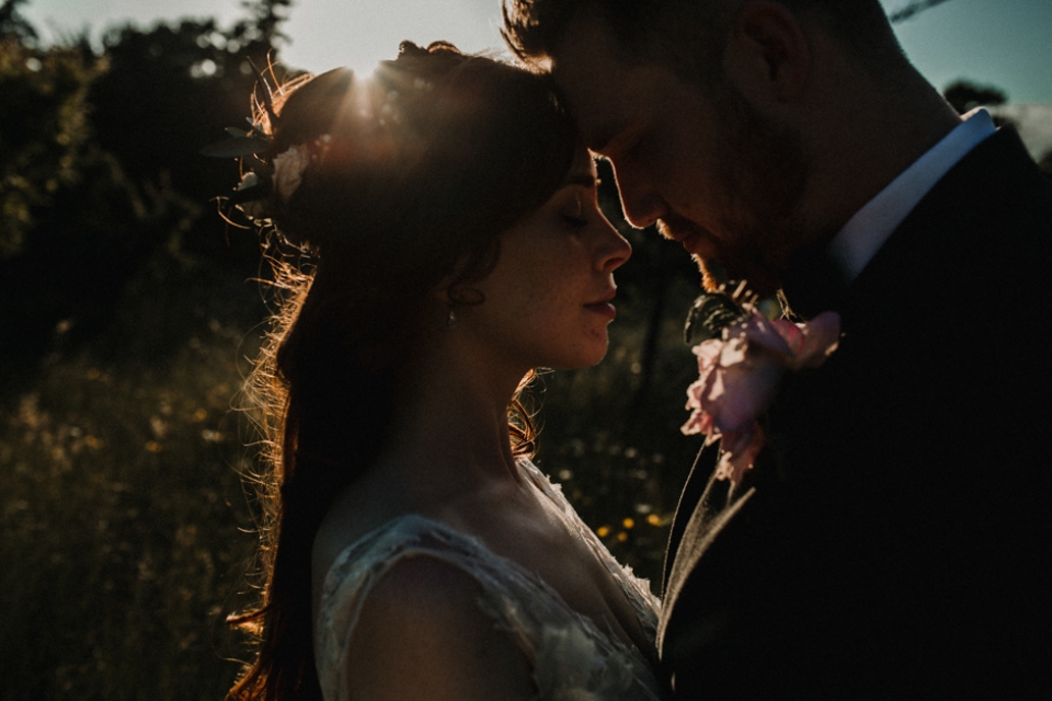 couple relaxing together , wedding photography at golden hour